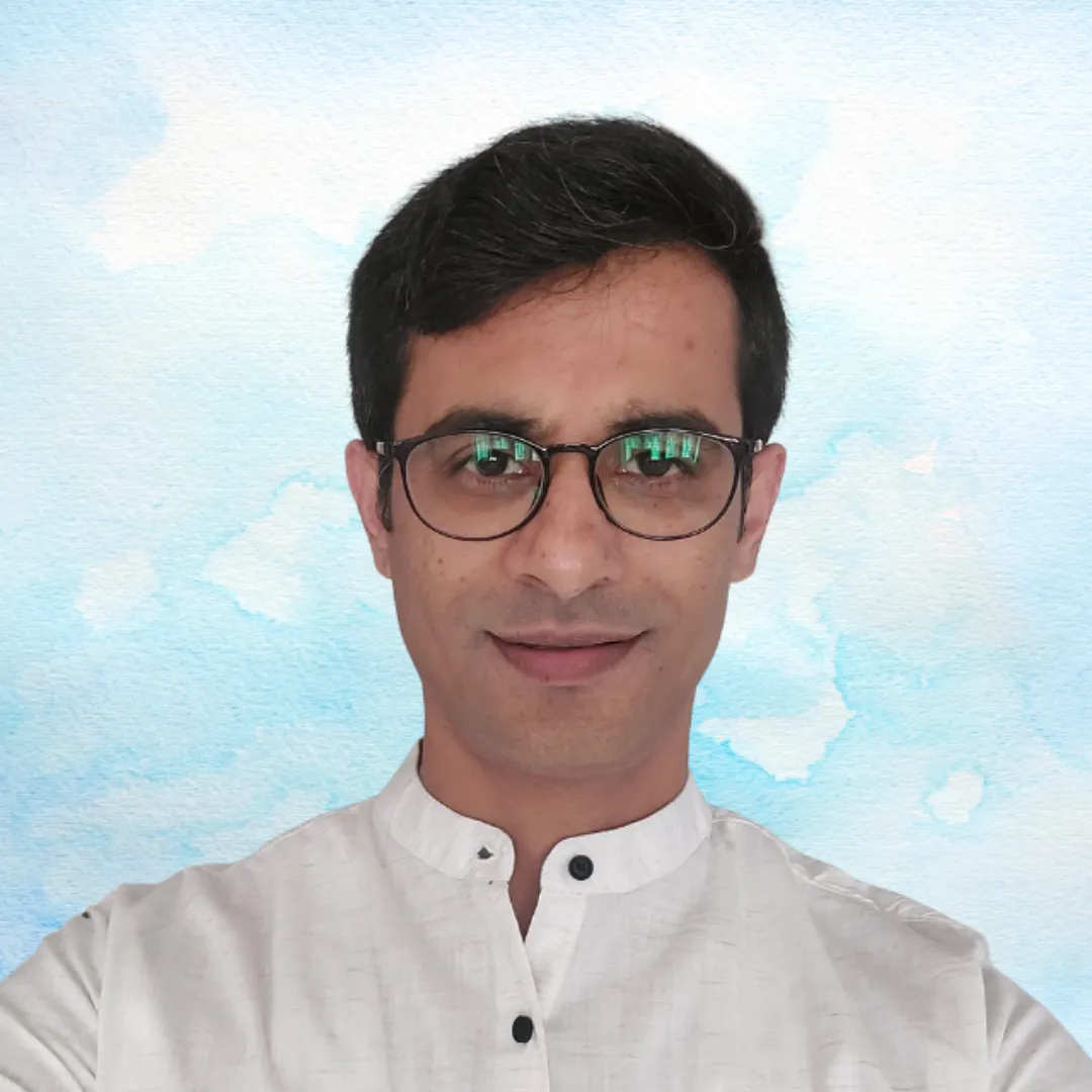 Headshot of Dr. Prasanna Kakunje, an Ayurvedic doctor and founder of Kakunje Wellness, smiling and wearing glasses. Client of OnlineShree.